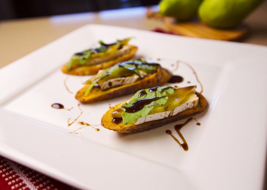 Honey Balsamic Glaze on Poached Pear Brie Crostini